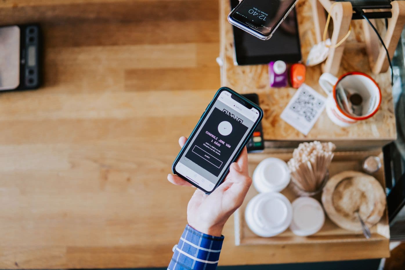 Customer scanning QR Code menu on restaurant dining table